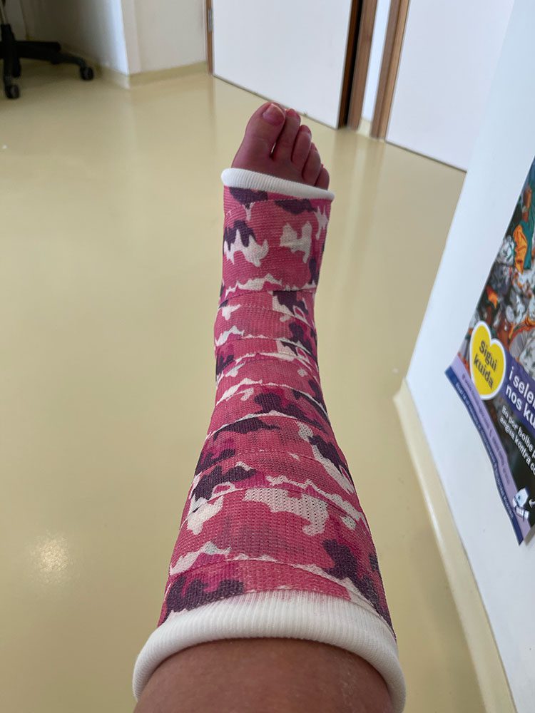 Leslie showing off her new pink camo cast following ankle surgery.